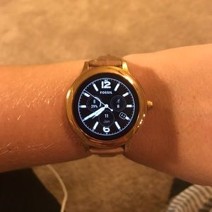 Fossil smart watch with charger.